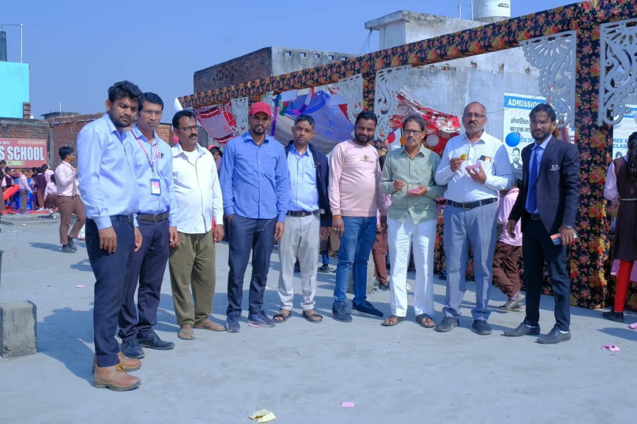 School staff and guests gathered outside the school entrance