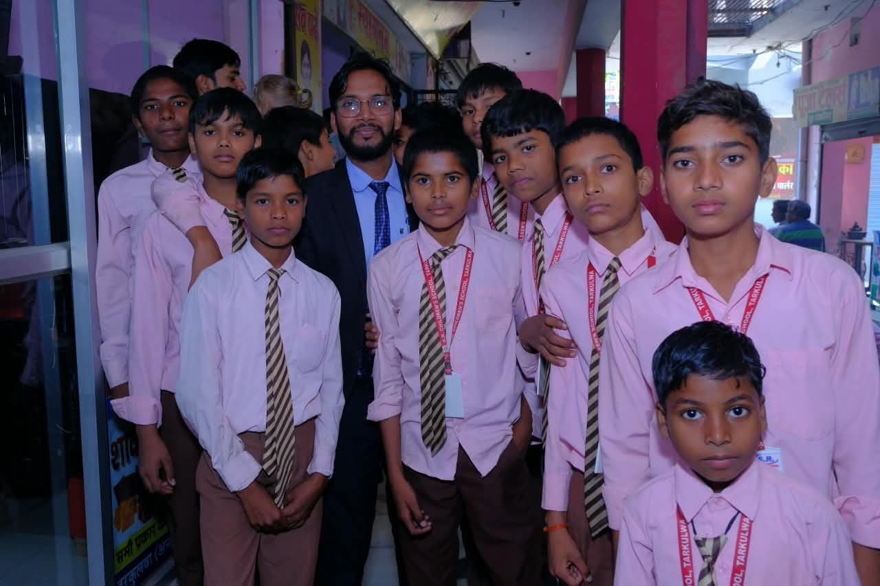 Students gathered with a teacher at S.R. Children's School